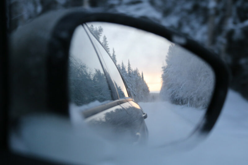 Winter forest in the rear view mirror
