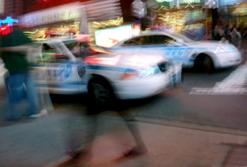 NYPD Cars at Times Square by Night